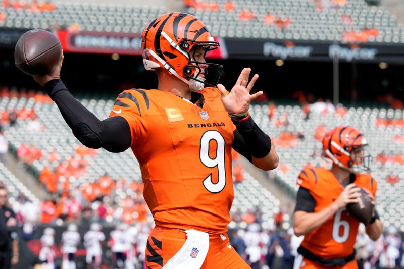 Cincinnati Bengals quarterback Joe Burrow (9) warms up before an NFL football game against the New England Patriots, Sunday, Sept. 8, 2024, in Cincinnati. (AP Photo/Jeff Dean)