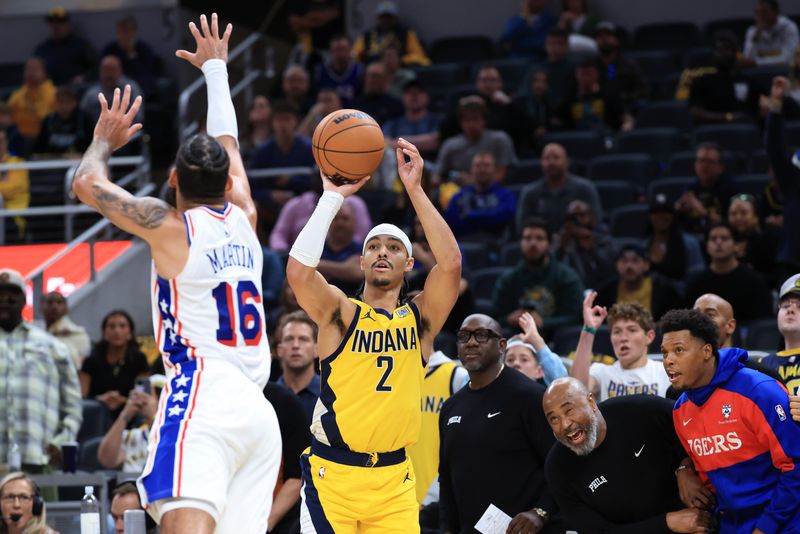 INDIANAPOLIS, INDIANA - OCTOBER 27: Andrew Nembhard #2 of the Indiana Pacers  takes a shot over Caleb Martin #16 of the Philadelphia 76ers in overtime at Gainbridge Fieldhouse on October 27, 2024 in Indianapolis, Indiana. NOTE TO USER: User expressly acknowledges and agrees that, by downloading and or using this photograph, User is consenting to the terms and conditions of the Getty Images License Agreement. (Photo by Justin Casterline/Getty Images)