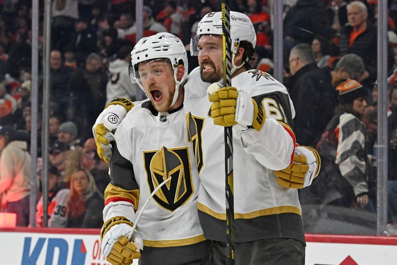 Dec 11, 2025; Philadelphia, Pennsylvania, USA; Vegas Golden Knights right wing Mark Stone (61) celebrates his game winning goal with center Jack Eichel (9) against the Philadelphia Flyers during the overtime period at Xfinity Mobile Arena. Mandatory Credit: Eric Hartline-Imagn Images