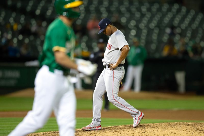 Apr 2, 2024; Oakland, California, USA; Boston Red Sox pitcher Brayan Bello (66) reacts to walking Oakland Athletics outfielder JJ Bleday (33) during the fifth inning at Oakland-Alameda County Coliseum. Mandatory Credit: D. Ross Cameron-USA TODAY Sports