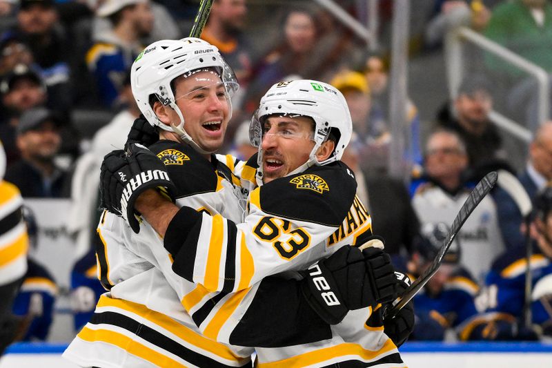 Nov 12, 2024; St. Louis, Missouri, USA;  Boston Bruins defenseman Charlie McAvoy (73) celebrates with left wing Brad Marchand (63) after scoring the game tying goal against the St. Louis Blues during the third period at Enterprise Center. Mandatory Credit: Jeff Curry-Imagn Images