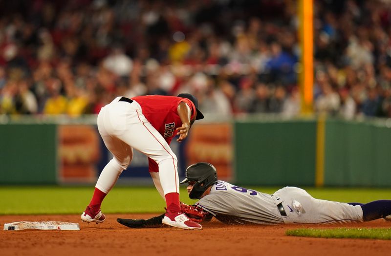 Jun 14, 2023; Boston, Massachusetts, USA; Colorado Rockies center fielder Brenton Doyle (9) tagged out at second base by Boston Red Sox second baseman Pablo Reyes (19) in the third inning at Fenway Park. Mandatory Credit: David Butler II-USA TODAY Sports