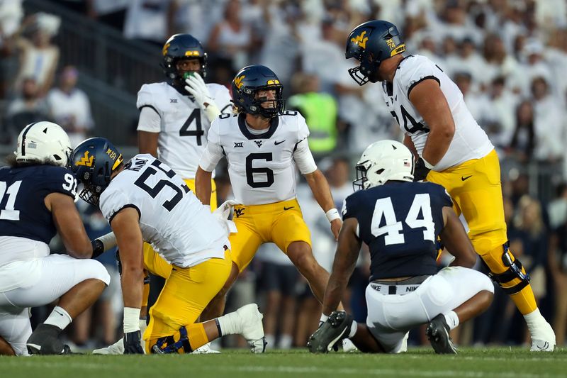 Sep 2, 2023; University Park, Pennsylvania, USA; West Virginia Mountaineers quarterback Garrett Greene (6) reacts from the line of scrimmage during the first quarter against the Penn State Nittany Lions at Beaver Stadium. Mandatory Credit: Matthew O'Haren-USA TODAY Sports