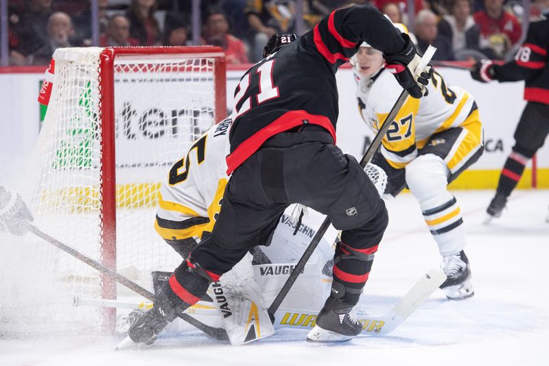 Mar 12, 2024; Ottawa, Ontario, CAN; Pittsburgh Penguins goalie Tristan Jarry (35) makes a save in front of Ottawa Senators right wing Mathieu Joseph (21) in the first period at the Canadian Tire Centre. Mandatory Credit: Marc DesRosiers-USA TODAY Sports