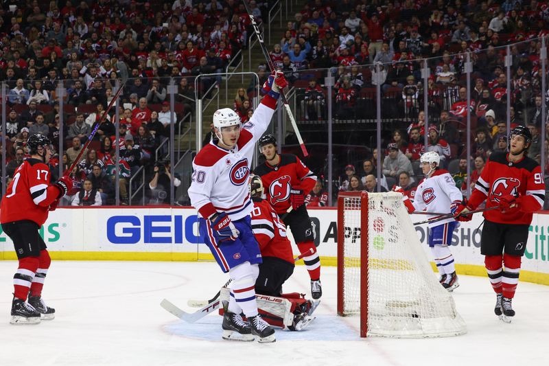 Jan 17, 2024; Newark, New Jersey, USA; Montreal Canadiens left wing Juraj Slafkovsky (20) celebrates his goal against the New Jersey Devils during the first period at Prudential Center. Mandatory Credit: Ed Mulholland-USA TODAY Sports