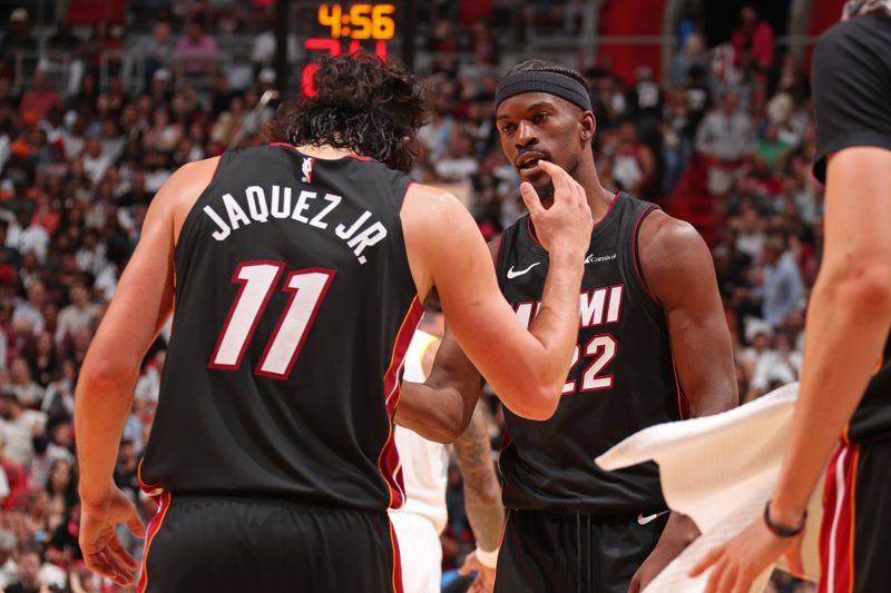 MIAMI, FL - MARCH 2: Jimmy Butler #22 of the Miami Heat high fives Jaime Jaquez Jr. #11 during the game against the Utah Jazz on March 2, 2024 at Kaseya Center in Miami, Florida. NOTE TO USER: User expressly acknowledges and agrees that, by downloading and or using this Photograph, user is consenting to the terms and conditions of the Getty Images License Agreement. Mandatory Copyright Notice: Copyright 2024 NBAE (Photo by Issac Baldizon/NBAE via Getty Images)