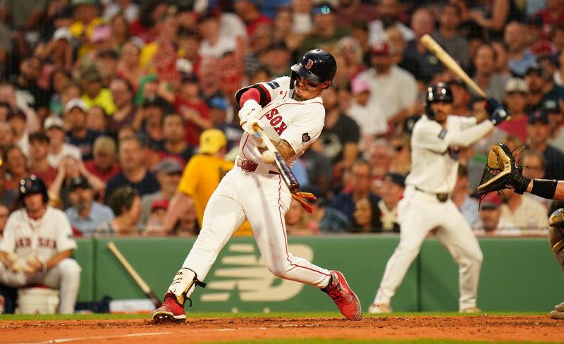 Jul 9, 2024; Boston, Massachusetts, USA; Boston Red Sox center fielder Jarren Duran (16) hits a sacrifice fly to drive in a run against the Oakland Athletics in the second inning at Fenway Park. Mandatory Credit: David Butler II-USA TODAY Sports