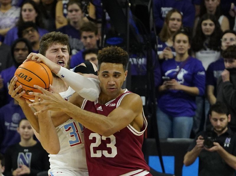 Feb 15, 2023; Evanston, Illinois, USA;Northwestern Wildcats center Matthew Nicholson (34) and Indiana Hoosiers forward Trayce Jackson-Davis (23) go for the ball during the first half at Welsh-Ryan Arena. Mandatory Credit: David Banks-USA TODAY Sports