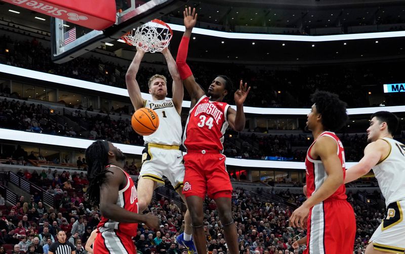 Mar 11, 2023; Chicago, IL, USA; Purdue Boilermakers forward Caleb Furst (1) dunks the ball on Ohio State Buckeyes center Felix Okpara (34) during the first half at United Center. Mandatory Credit: David Banks-USA TODAY Sports