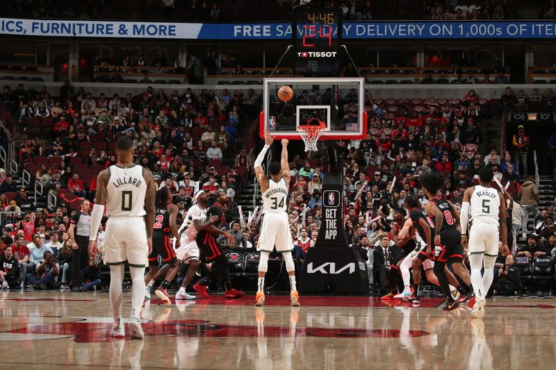 CHICAGO, IL - MARCH 1: Damian Lillard #0 of the Milwaukee Bucks looks on while Giannis Antetokounmpo #34 shoots a free throw during the game against the Chicago Bulls on March 1, 2024 at United Center in Chicago, Illinois. NOTE TO USER: User expressly acknowledges and agrees that, by downloading and or using this photograph, User is consenting to the terms and conditions of the Getty Images License Agreement. Mandatory Copyright Notice: Copyright 2024 NBAE (Photo by Gary Dineen/NBAE via Getty Images)