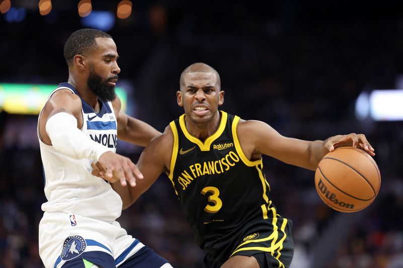 SAN FRANCISCO, CALIFORNIA - NOVEMBER 14: Chris Paul #3 of the Golden State Warriors is guarded by Mike Conley #10 of the Minnesota Timberwolves at Chase Center on November 14, 2023 in San Francisco, California. NOTE TO USER: User expressly acknowledges and agrees that, by downloading and or using this photograph, User is consenting to the terms and conditions of the Getty Images License Agreement.  (Photo by Ezra Shaw/Getty Images)