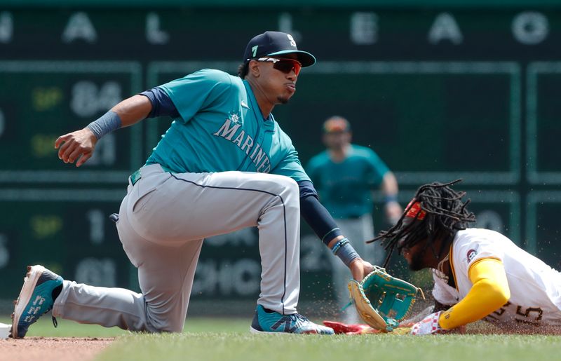 Aug 17, 2024; Pittsburgh, Pennsylvania, USA;  Pittsburgh Pirates designated hitter shortstop Oneil Cruz (15) steals second base as Seattle Mariners shortstop Leo Rivas (76) applies a late tag during the fourth inning at PNC Park. Mandatory Credit: Charles LeClaire-USA TODAY Sports