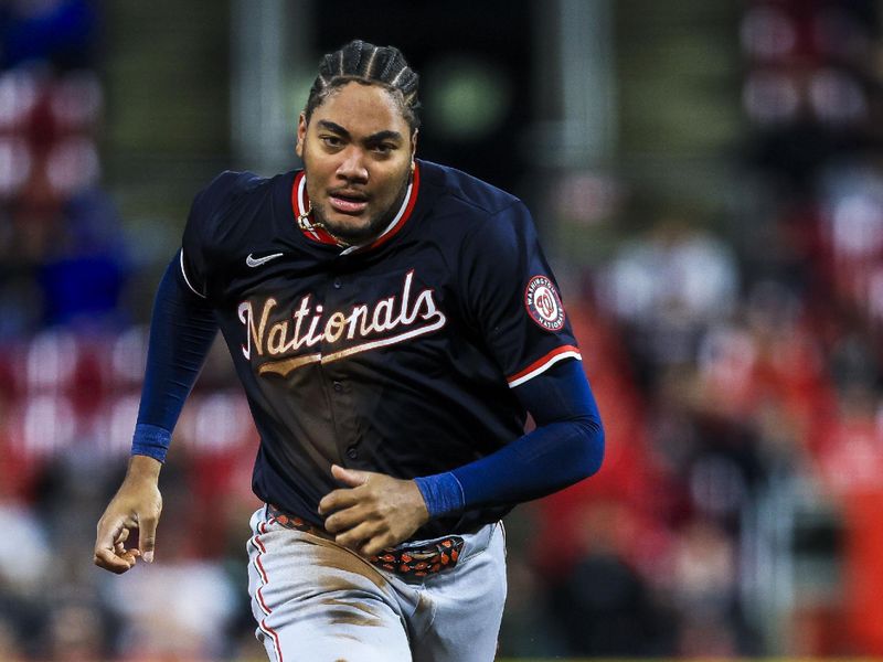 May 3, 2025; Cincinnati, Ohio, USA; Washington Nationals designated hitter James Wood (29) steals third on an error in the sixth inning against the Cincinnati Reds at Great American Ball Park. Mandatory Credit: Katie Stratman-Imagn Images