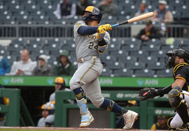 May 22, 2025; Pittsburgh, Pennsylvania, USA;  Milwaukee Brewers catcher William Contreras (24) hits a single against the Pittsburgh Pirates during the first inning at PNC Park. Mandatory Credit: Charles LeClaire-Imagn Images
