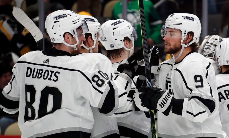 Feb 18, 2024; Pittsburgh, Pennsylvania, USA;  Los Angeles Kings center Pierre-Luc Dubois (80) and right wing Adrian Kempe (9) celebrate after defeating the Pittsburgh Penguins at PPG Paints Arena. Los Angeles won 2-1. Mandatory Credit: Charles LeClaire-USA TODAY Sports