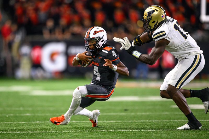 Sep 21, 2024; Corvallis, Oregon, USA; Oregon State Beavers quarterback Gevani McCoy (4) runs the ball during the second half against the Purdue Boilermakers at Reser Stadium. Mandatory Credit: Craig Strobeck-Imagn Images