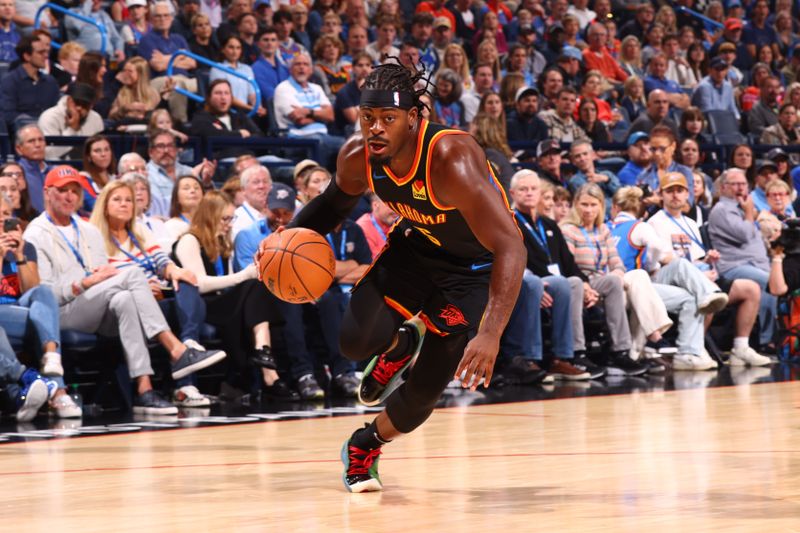 OKLAHOMA CITY, OK - NOVEMBER 17: Luguentz Dort #5 of the Oklahoma City Thunder dribbles the ball during the game against the Dallas Mavericks on November 17, 2024 at Paycom Center in Oklahoma City, Oklahoma. NOTE TO USER: User expressly acknowledges and agrees that, by downloading and or using this photograph, User is consenting to the terms and conditions of the Getty Images License Agreement. Mandatory Copyright Notice: Copyright 2024 NBAE (Photo by Zach Beeker/NBAE via Getty Images)