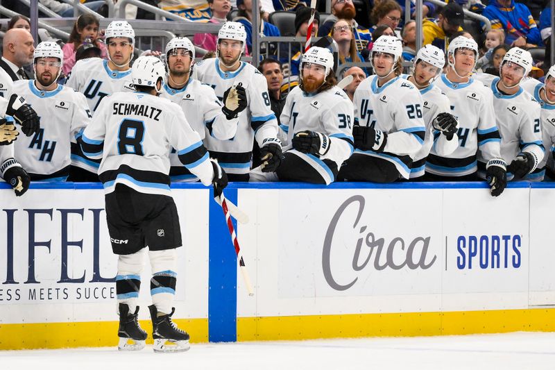 Oct 23, 2025; St. Louis, Missouri, USA; Utah Mammoth center Nick Schmaltz (8) is congratulated by teammates after scoring against the St. Louis Blues during the third period at Enterprise Center. Mandatory Credit: Jeff Curry-Imagn Images