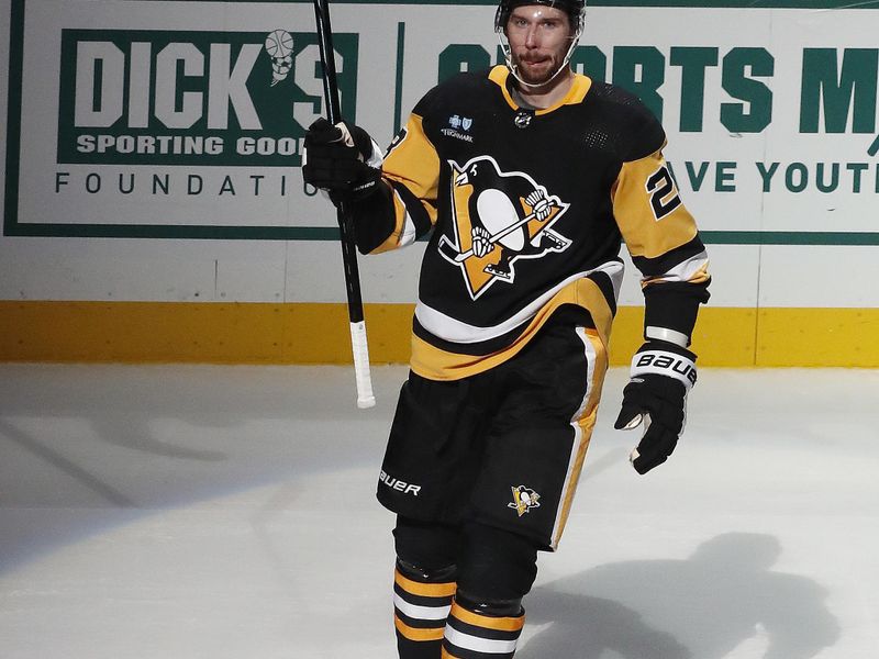 Jan 27, 2024; Pittsburgh, Pennsylvania, USA;  Pittsburgh Penguins defenseman Marcus Pettersson (28) reacts after being named first star of he game for scoring an overtime goal to defeat the Montreal Canadiens at PPG Paints Arena. The Penguins won 3-2 in overtime. Mandatory Credit: Charles LeClaire-USA TODAY Sports