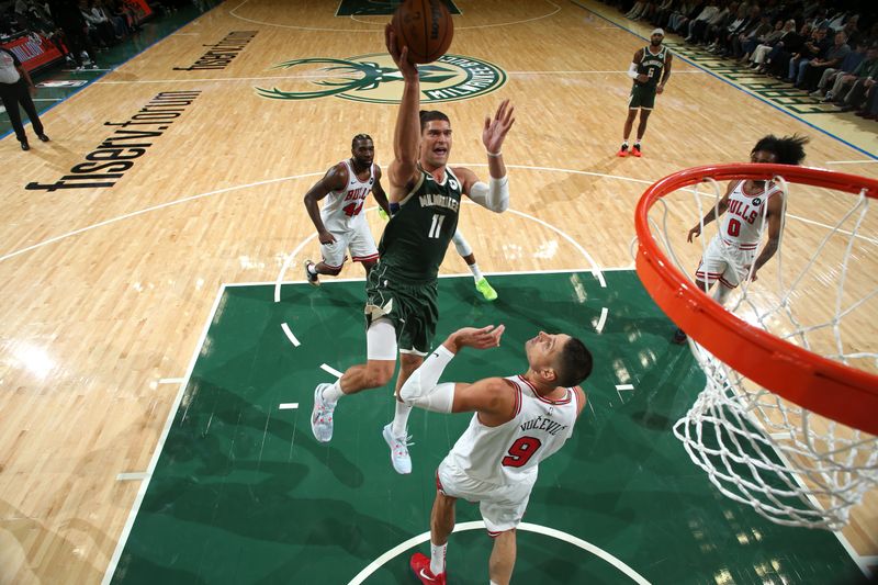 MILWAUKEE, WI - OCTOBER 25: Brook Lopez #11 of the Milwaukee Bucks drives to the basket during the game against the Chicago Bulls on October 25, 2024 at the Fiserv Forum Center in Milwaukee, Wisconsin. NOTE TO USER: User expressly acknowledges and agrees that, by downloading and or using this Photograph, user is consenting to the terms and conditions of the Getty Images License Agreement. Mandatory Copyright Notice: Copyright 2024 NBAE (Photo by Gary Dineen/NBAE via Getty Images).