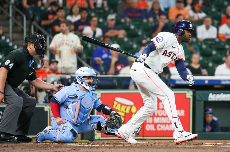 Apr 23, 2025; Houston, Texas, USA; Houston Astros designated hitter Yordan Alvarez (44) hits a single against the Toronto Blue Jays in the first inning at Daikin Park. Mandatory Credit: Thomas Shea-Imagn Images