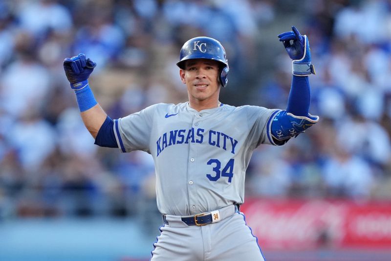 Jun 15, 2024; Los Angeles, California, USA; Kansas City Royals catcher Freddy Fermin (34) gestures after hitting a double against the Los Angeles Dodgers in the fourth inning at Dodger Stadium. Mandatory Credit: Kirby Lee-USA TODAY Sports