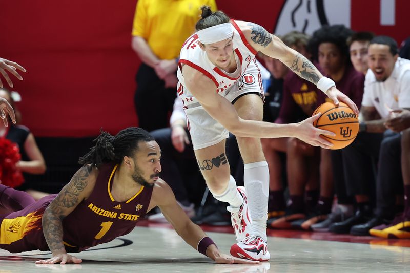 Feb 10, 2024; Salt Lake City, Utah, USA; Arizona State Sun Devils guard Frankie Collins (1) dives for a ball held by Utah Utes guard Gabe Madsen (55) during the first half at Jon M. Huntsman Center. Mandatory Credit: Rob Gray-USA TODAY Sports