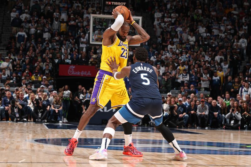 MINNEAPOLIS, MN -  APRIL 25:   Anthony Edwards #5 of the Minnesota Timberwolves plays defense on LeBron James #23 of the Los Angeles Lakers during the game   during Round 1 Game 3 of the 2025 NBA Playoffs  on April 25, 2025 at Target Center in Minneapolis, Minnesota. NOTE TO USER: User expressly acknowledges and agrees that, by downloading and or using this Photograph, user is consenting to the terms and conditions of the Getty Images License Agreement. Mandatory Copyright Notice: Copyright 2025 NBAE (Photo by David Sherman/NBAE via Getty Images)