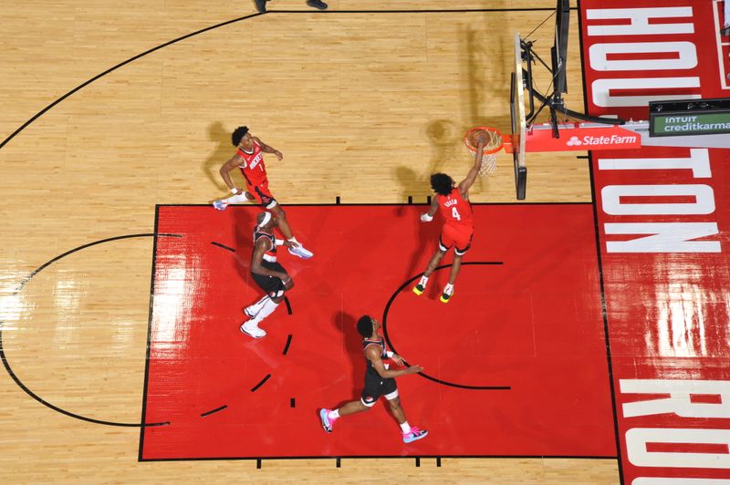 HOUSTON, TX - MARCH 25: Jalen Green #4 of the Houston Rockets dunks the ball during the game against the Portland Trail Blazers on March 25, 2024 at the Toyota Center in Houston, Texas. NOTE TO USER: User expressly acknowledges and agrees that, by downloading and or using this photograph, User is consenting to the terms and conditions of the Getty Images License Agreement. Mandatory Copyright Notice: Copyright 2024 NBAE (Photo by Logan Riely/NBAE via Getty Images)