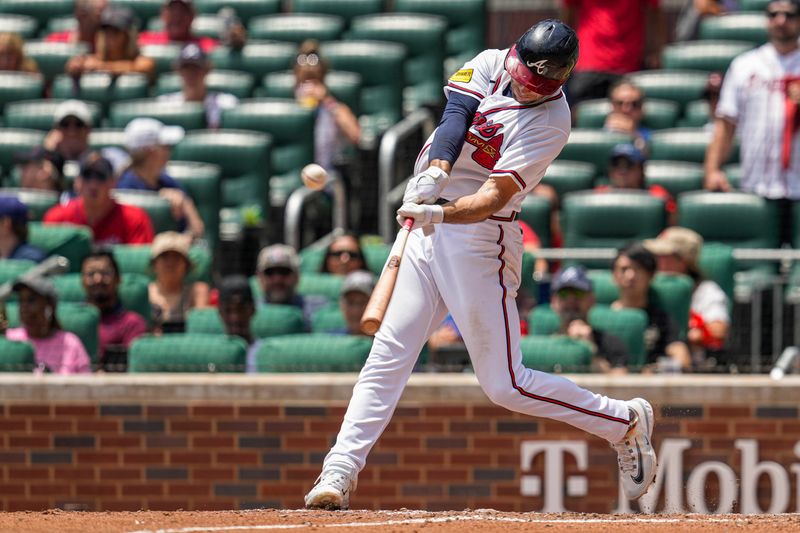 Jul 20, 2023; Cumberland, Georgia, USA; Atlanta Braves first baseman Matt Olson (28) hits a home run against the Arizona Diamondbacks during the seventh inning at Truist Park. Mandatory Credit: Dale Zanine-USA TODAY Sports