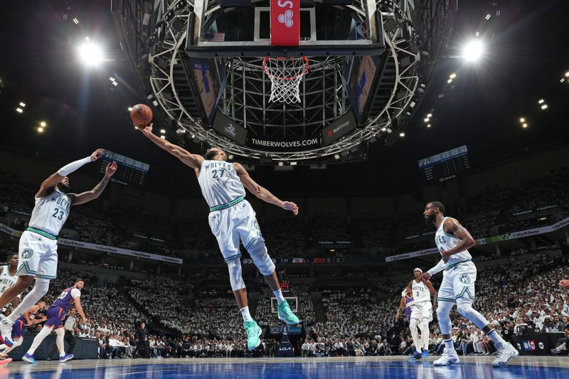 MINNEAPOLIS, MN -  APRIL 23: Rudy Gobert #27 of the Minnesota Timberwolves grabs a rebound during the game against the Phoenix Suns during Round 1 Game 2 of the 2024 NBA Playoffs on April 23, 2024 at Target Center in Minneapolis, Minnesota. NOTE TO USER: User expressly acknowledges and agrees that, by downloading and or using this Photograph, user is consenting to the terms and conditions of the Getty Images License Agreement. Mandatory Copyright Notice: Copyright 2024 NBAE (Photo by David Sherman/NBAE via Getty Images)