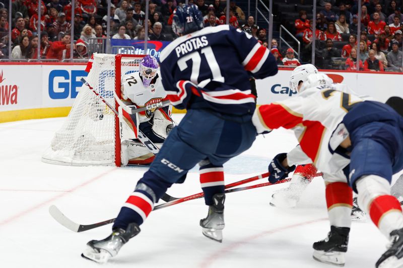 Nov 8, 2023; Washington, District of Columbia, USA; Florida Panthers goaltender Sergei Bobrovsky (72) makes a save on Washington Capitals center Aliaksei Protas (21) in the third period at Capital One Arena. Mandatory Credit: Geoff Burke-USA TODAY Sports