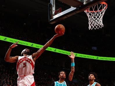 TORONTO, CANADA - DECEMBER 18:  Precious Achiuwa #5 of the Toronto Raptors drives to the basket during the game against the Charlotte Hornets on December 18, 2023 at the Scotiabank Arena in Toronto, Ontario, Canada.  NOTE TO USER: User expressly acknowledges and agrees that, by downloading and or using this Photograph, user is consenting to the terms and conditions of the Getty Images License Agreement.  Mandatory Copyright Notice: Copyright 2023 NBAE (Photo by Vaughn Ridley/NBAE via Getty Images)