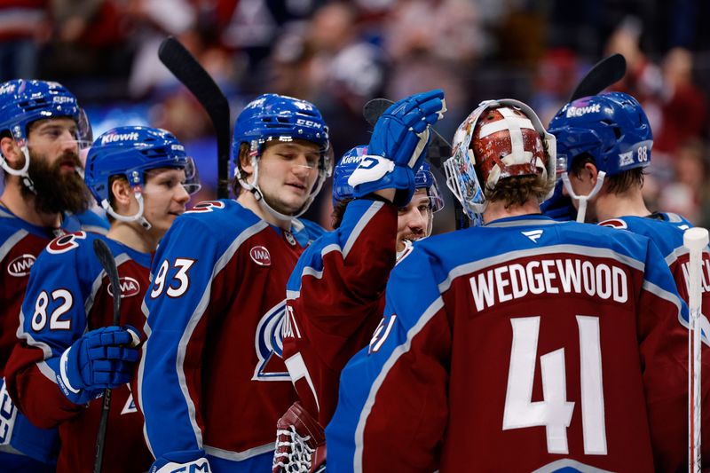 Jan 19, 2026; Denver, Colorado, USA; Colorado Avalanche defenseman Samuel Girard (49) and center Zakhar Bardakov (93) celebrate with goaltender Scott Wedgewood (41) after the game against the Washington Capitals at Ball Arena. Mandatory Credit: Isaiah J. Downing-Imagn Images