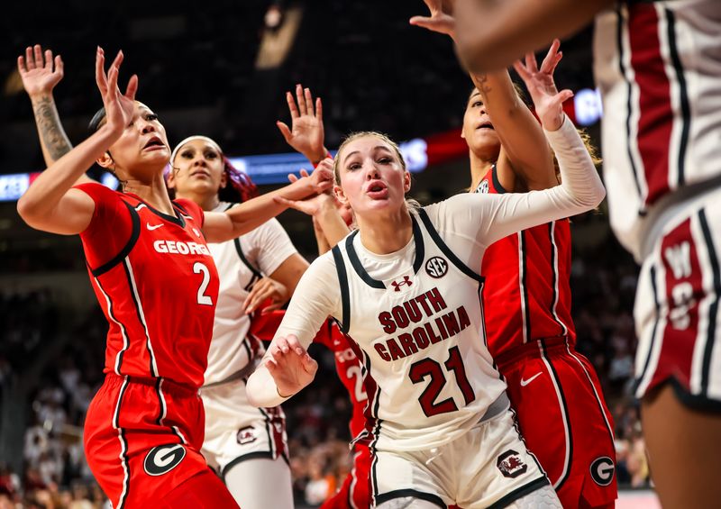 Feb 18, 2024; Columbia, South Carolina, USA; South Carolina Gamecocks forward Chloe Kitts (21) and Georgia Lady Bulldogs guard Savannah Henderson (2) vie for an inbounds pass in the second half at Colonial Life Arena. Mandatory Credit: Jeff Blake-USA TODAY Sports