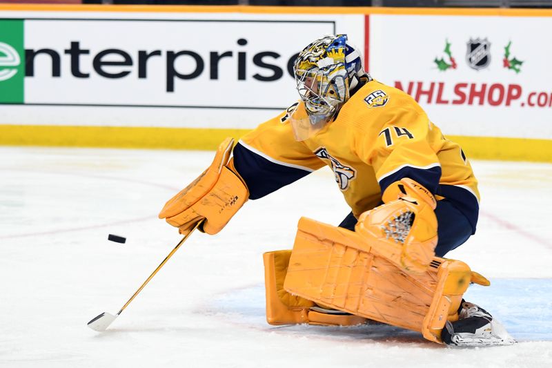 Nov 26, 2023; Nashville, Tennessee, USA; Nashville Predators goaltender Juuse Saros (74) makes a save during the second period against the Winnipeg Jets at Bridgestone Arena. Mandatory Credit: Christopher Hanewinckel-USA TODAY Sports