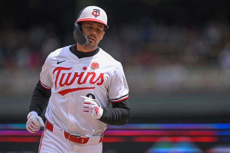 May 27, 2024; Minneapolis, Minnesota, USA; Minnesota Twins designated hitter Trevor Larnach (9) rounds the bases after hitting a three-run home run against the Kansas City Royals during the fifth inning at Target Field. Mandatory Credit: Nick Wosika-USA TODAY Sports