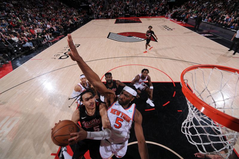 PORTLAND, OR - MARCH 14: Dalano Banton #5 of the Portland Trail Blazers drives to the basket during the game against the New York Knicks on March 14, 2024 at the Moda Center Arena in Portland, Oregon. NOTE TO USER: User expressly acknowledges and agrees that, by downloading and or using this photograph, user is consenting to the terms and conditions of the Getty Images License Agreement. Mandatory Copyright Notice: Copyright 2024 NBAE (Photo by Cameron Browne/NBAE via Getty Images)