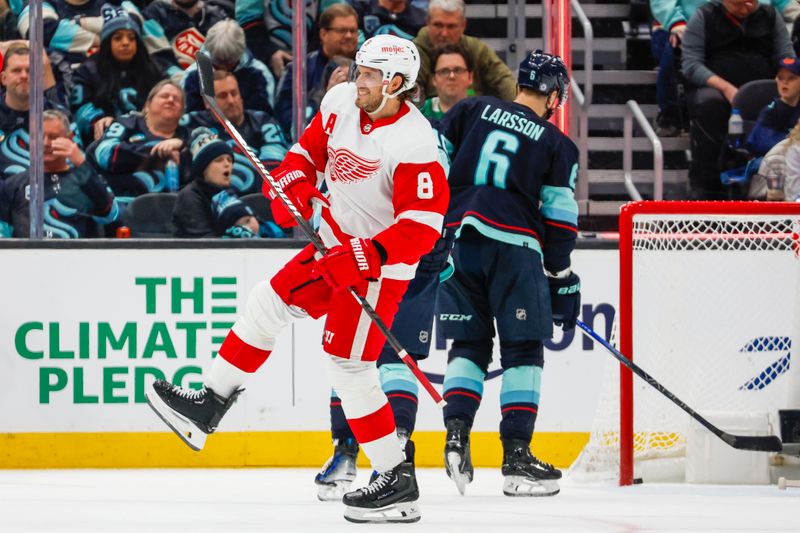 Feb 19, 2024; Seattle, Washington, USA; Seattle Kraken left wing Jared McCann (19) celebrates after scoring a goal against the Detroit Red Wings during the second period at Climate Pledge Arena. Mandatory Credit: Joe Nicholson-USA TODAY Sports