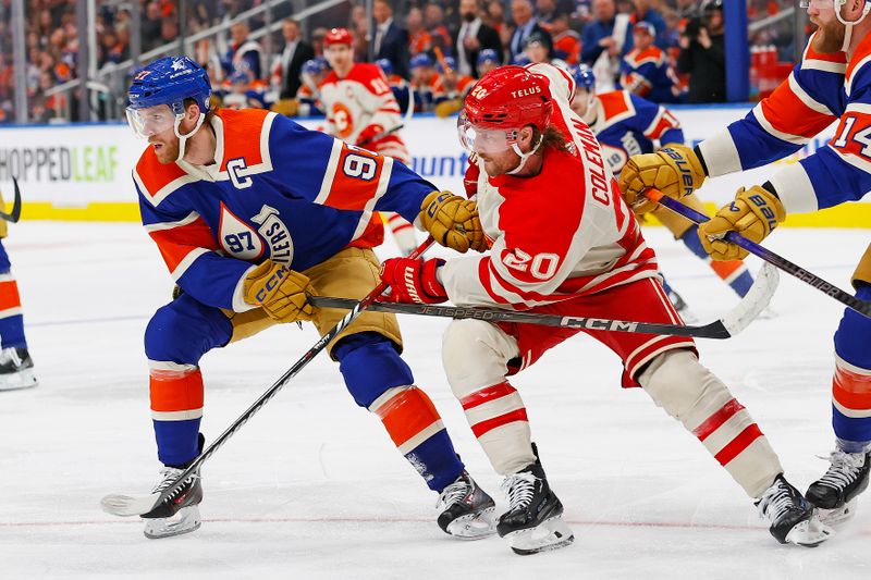 Feb 24, 2024; Edmonton, Alberta, CAN; Edmonton Oilers forward Connor McDavid (97) and Calgary Flames forward Blake Coleman (20) battle for position during the second period at Rogers Place. Mandatory Credit: Perry Nelson-USA TODAY Sports