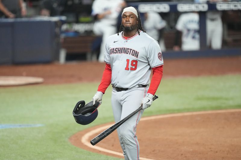Sep 11, 2025; Miami, Florida, USA;  Washington Nationals first baseman Josh Bell (19) walks back to the dugout after striking out looking while pinch-hitting in the eighth inning against the Miami Marlins at loanDepot Park. Mandatory Credit: Jim Rassol-Imagn Images
