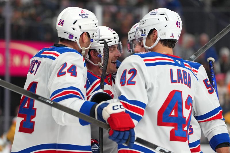 Nov 18, 2025; Las Vegas, Nevada, USA; New York Rangers center Jonny Brodzinski (22) celebrates with team mates after scoring a goal against the Vegas Golden Knights during the second period at T-Mobile Arena. Mandatory Credit: Stephen R. Sylvanie-Imagn Images