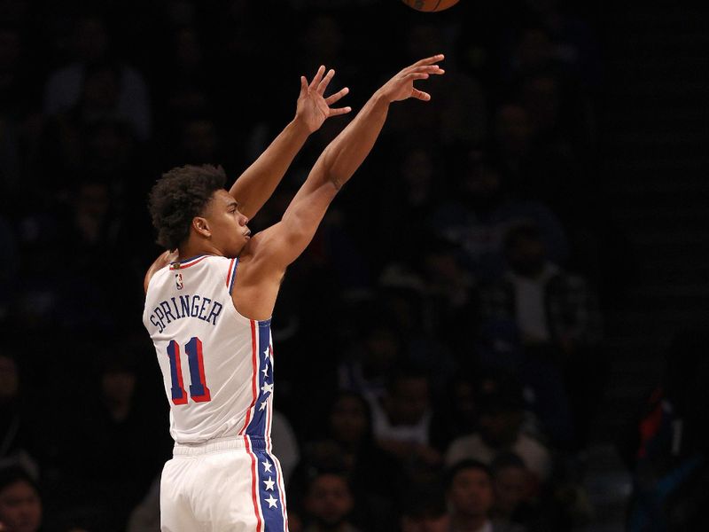 NEW YORK, NEW YORK - NOVEMBER 19:  Jaden Springer #11 of the Philadelphia 76ers takes a shot in the first half against the Brooklyn Nets at Barclays Center on November 19, 2023 in the Brooklyn borough of New York City. NOTE TO USER: User expressly acknowledges and agrees that, by downloading and or using this photograph, User is consenting to the terms and conditions of the Getty Images License Agreement. (Photo by Elsa/Getty Images)