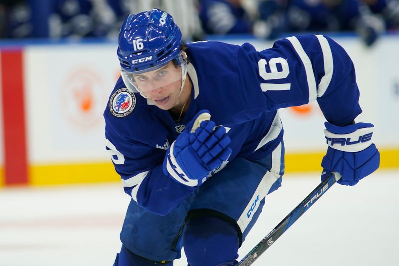 Nov 8, 2024; Toronto, Ontario, CAN; Toronto Maple Leafs forward Mitch Marner (16) displays a Hockey Hall of Fame induction patch on his shoulder as he skates against the Detroit Red Wings during the third period at Scotiabank Arena. Mandatory Credit: John E. Sokolowski-Imagn Images