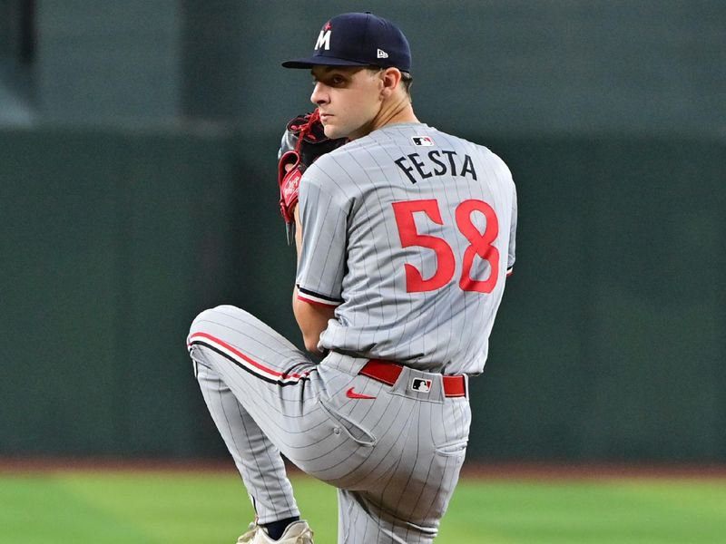 Jun 27, 2024; Phoenix, Arizona, USA;  Minnesota Twins pitcher David Festa (58) throws in the first inning against the Arizona Diamondbacks at Chase Field. Mandatory Credit: Matt Kartozian-USA TODAY Sports