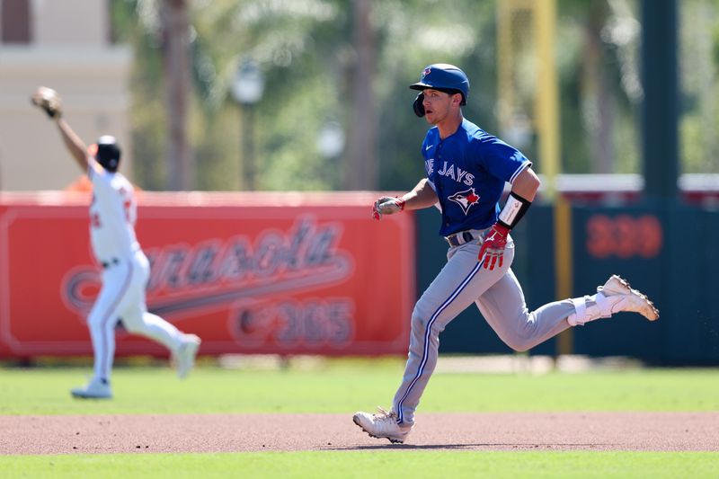 Mar 1, 2023; Sarasota, Florida, USA;  Toronto Blue Jays catcher Rob Brantly (55) hruns to second base after hitting an rbi double against the Baltimore Orioles in the fourth inning during spring training at  Ed Smith Stadium. Mandatory Credit: Nathan Ray Seebeck-USA TODAY Sports