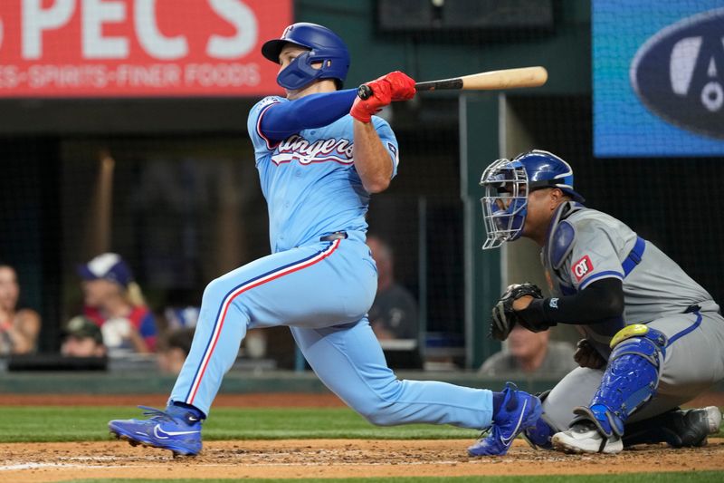 Jun 23, 2024; Arlington, Texas, USA; Texas Rangers left fielder Wyatt Langford (36) follows through on a RBI double against the Kansas City Royals during the fourth inning at Globe Life Field. Mandatory Credit: Jim Cowsert-USA TODAY Sports