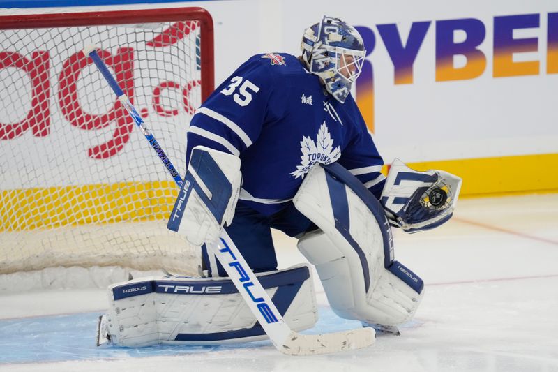 Nov 6, 2023; Toronto, Ontario, CAN; Toronto Maple Leafs goaltender Ilya Samsonov (35) makes a save during warm up before a game against the Tampa Bay Lightning at Scotiabank Arena. Mandatory Credit: John E. Sokolowski-USA TODAY Sports