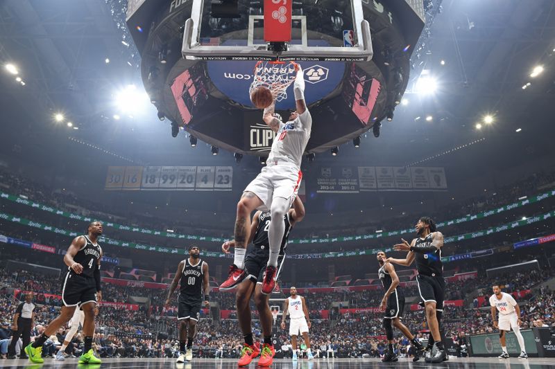 LOS ANGELES, CA - JANUARY 21: Daniel Theis #10 of the LA Clippers dunks the ball during the game against the Brooklyn Nets on January 21, 2024 at Crypto.Com Arena in Los Angeles, California. NOTE TO USER: User expressly acknowledges and agrees that, by downloading and/or using this Photograph, user is consenting to the terms and conditions of the Getty Images License Agreement. Mandatory Copyright Notice: Copyright 2024 NBAE (Photo by Adam Pantozzi/NBAE via Getty Images)