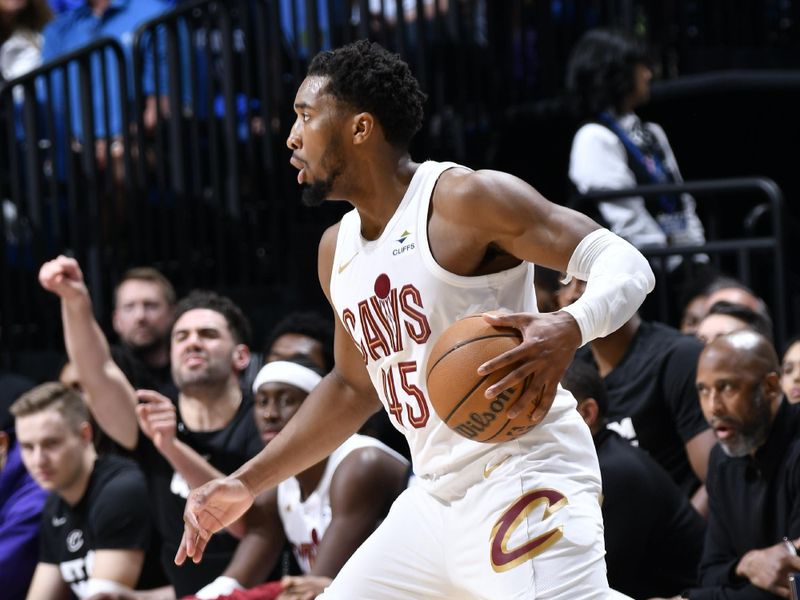 ORLANDO, FL - APRIL 27: Donovan Mitchell #45 of the Cleveland Cavaliers dribbles the ball during the game against the Orlando Magic  during Round 1 Game 4 of the 2024 NBA Playoffs on April 27, 2024 at the Kia Center in Orlando, Florida. NOTE TO USER: User expressly acknowledges and agrees that, by downloading and or using this photograph, User is consenting to the terms and conditions of the Getty Images License Agreement. Mandatory Copyright Notice: Copyright 2024 NBAE (Photo by Fernando Medina/NBAE via Getty Images)